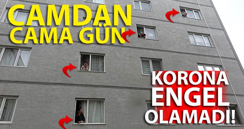 Evden çıkamayan komşular camdan cama gün yaptı