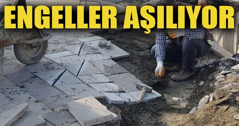Kaldırımlara engelli rampası yapılarak engeller aşılıyor