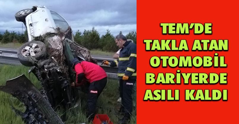 TEM’de takla atan otomobil bariyerde asılı kaldı: 3 yaralı