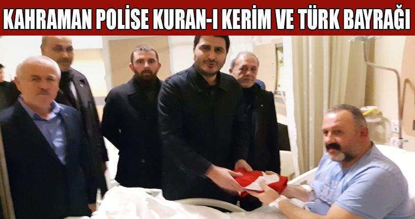 MHP’lilerden Kahraman polise Kuran-ı Kerim ve  Türk Bayrağı