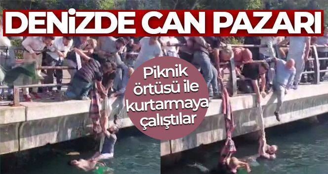 Üsküdar'da denizde can pazarı! Piknik örtüsü ile kurtarmaya çalıştılar