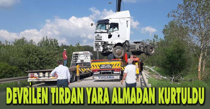 Devrilen tırdan yara almadan kurtuldu