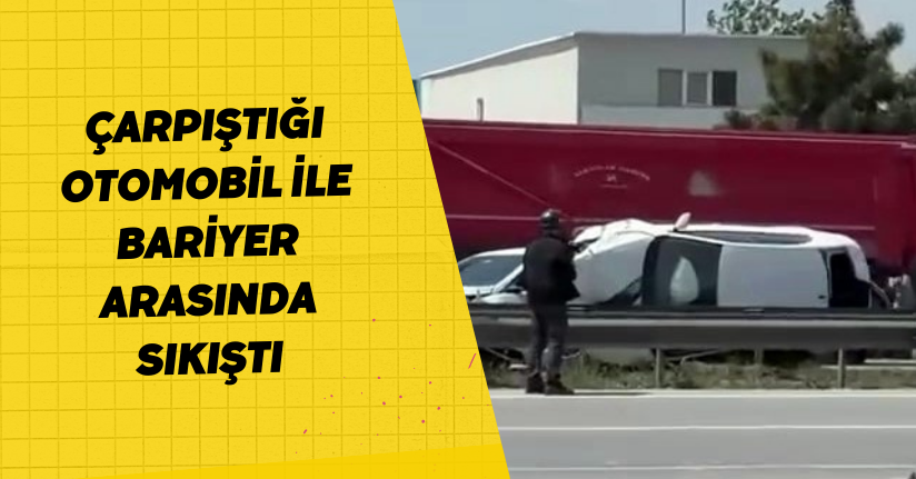 Çarpıştığı otomobil ile bariyer arasında sıkıştı