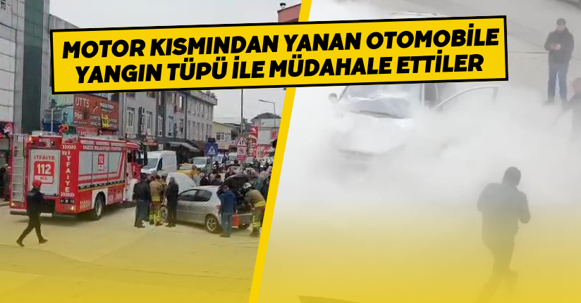  Motor kısmından yanan otomobile yangın tüpü ile müdahale ettiler