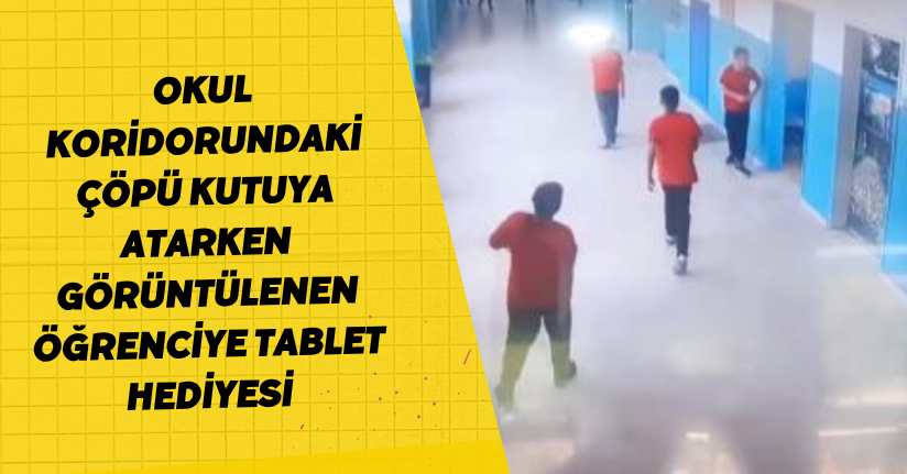 Okul koridorundaki çöpü kutuya atarken görüntülenen öğrenciye tablet hediyesiOkul koridorundaki çöpü kutuya atarken görüntülenen öğrenciye tablet hediyesi