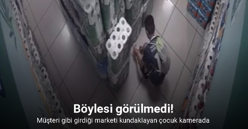 Müşteri gibi girdiği marketi kundaklayan çocuk kamerada