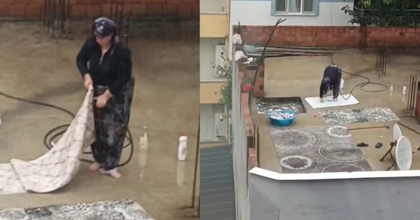 Yağmurlu havada çatıda halı yıkadı, görenler şaştı kaldı