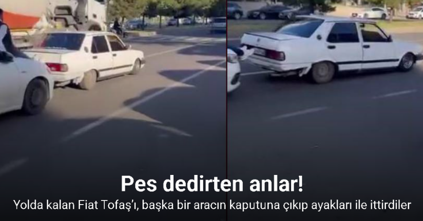 Yolda kalan Fiat Tofaş’ı, başka bir aracın kaputuna çıkıp ayakları ile ittirdiler