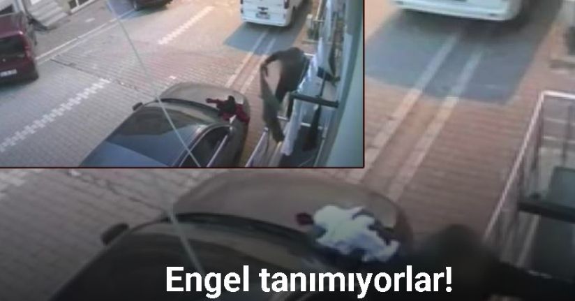 Esenyurt’ta binaya tırmanan şahıs camda asılı duran elbiseleri çaldı