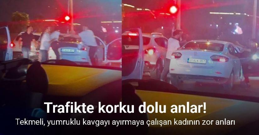 Trafikte yaşanan tekmeli, yumruklu kavgayı ayırmaya çalışan kadının zor anları kamerada