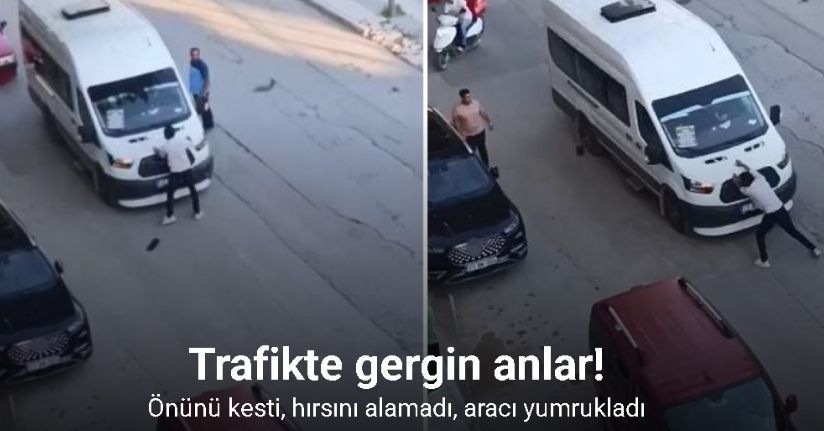 Önünü kestiği yolcu minibüsünü yumrukladı