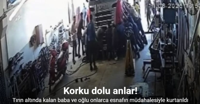 Tırın altında kalan baba ve oğlu onlarca esnafın müdahalesiyle kurtarıldı