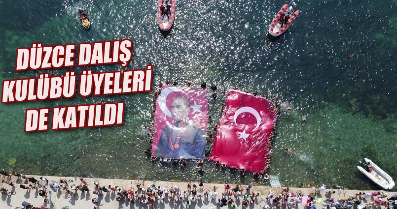 Bayrağı gören dalgalandırmak için denize atladı
