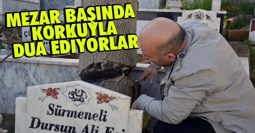 Mezar başında korkuyla dua ediyorlar